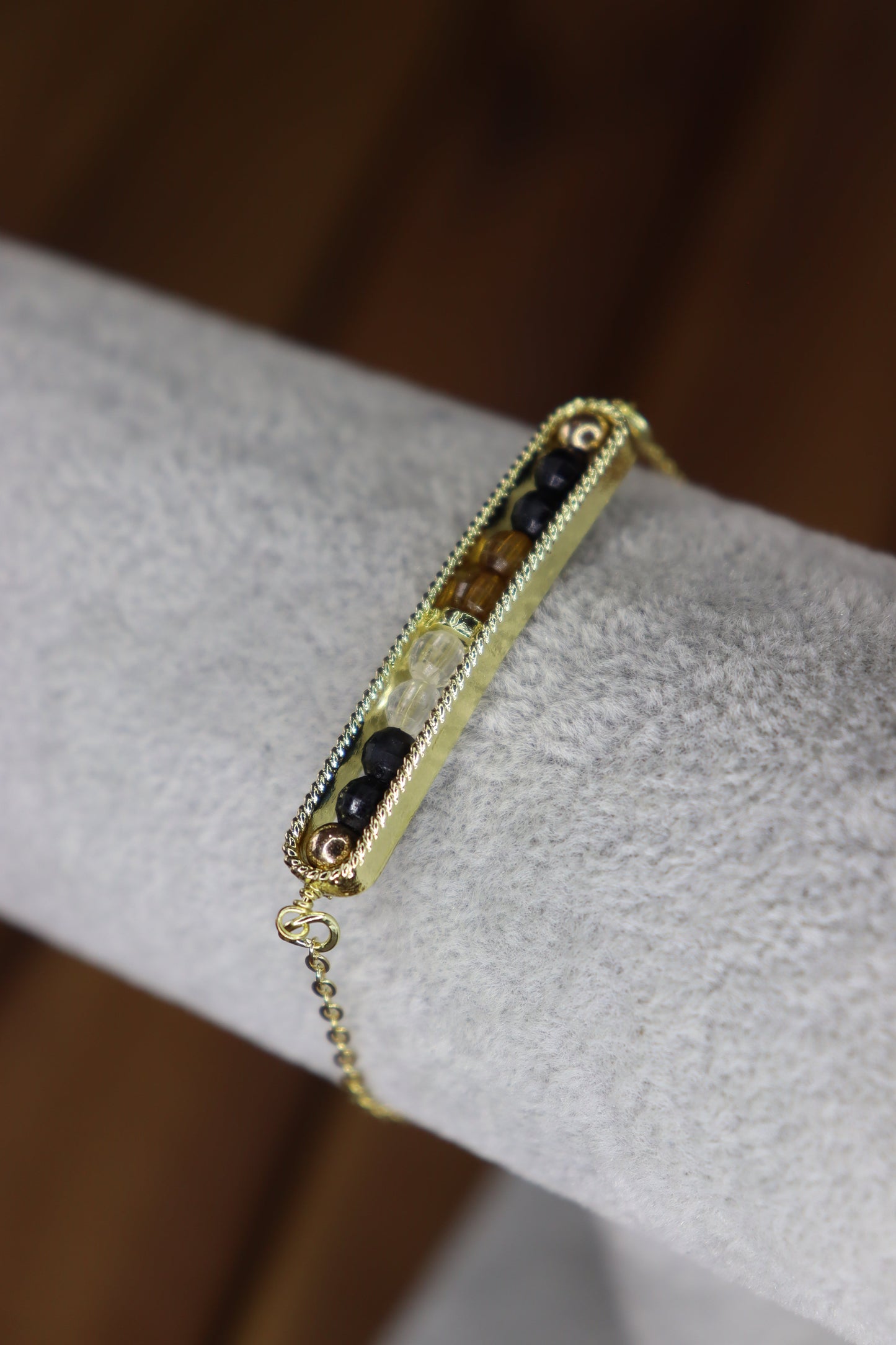 Gold bracelet with embedded stones